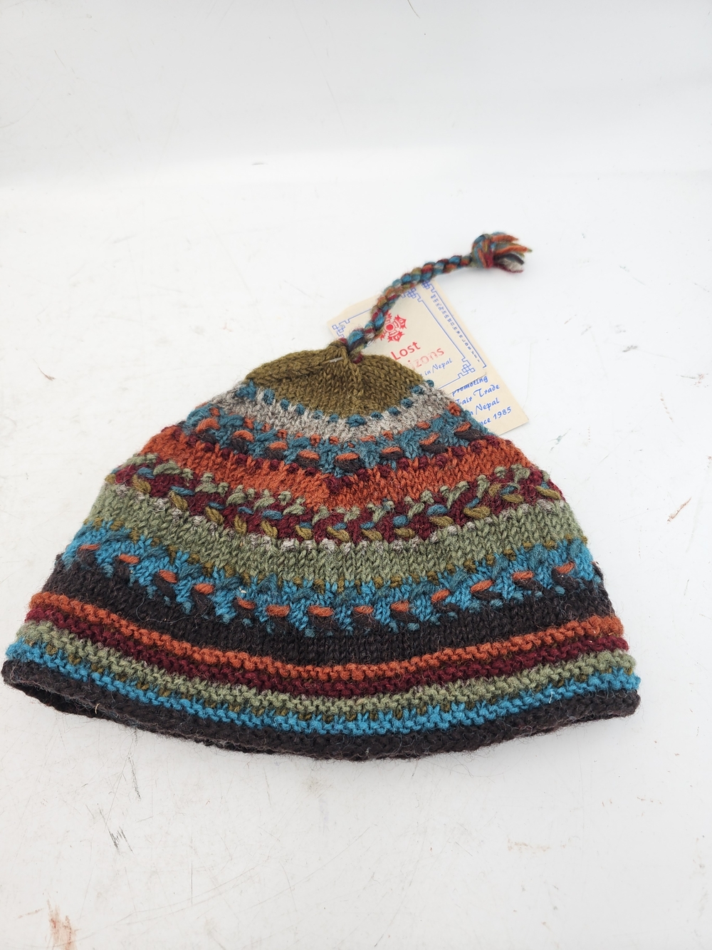Lost Horizons Multicolor Striped Knit Hat with Braided Tassel - Picture 4 of 5